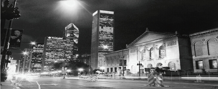 chicago at night with buildings all lit up with road work being done Domestic Battery